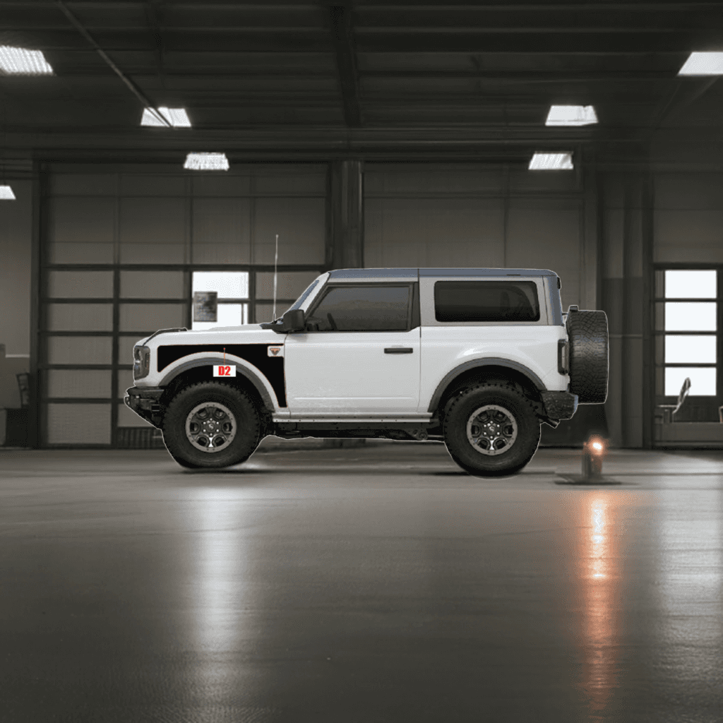 White Bronco 2D vehicle in a garage showcasing replacement parts for customization and repair. Ideal for Bronco enthusiasts.